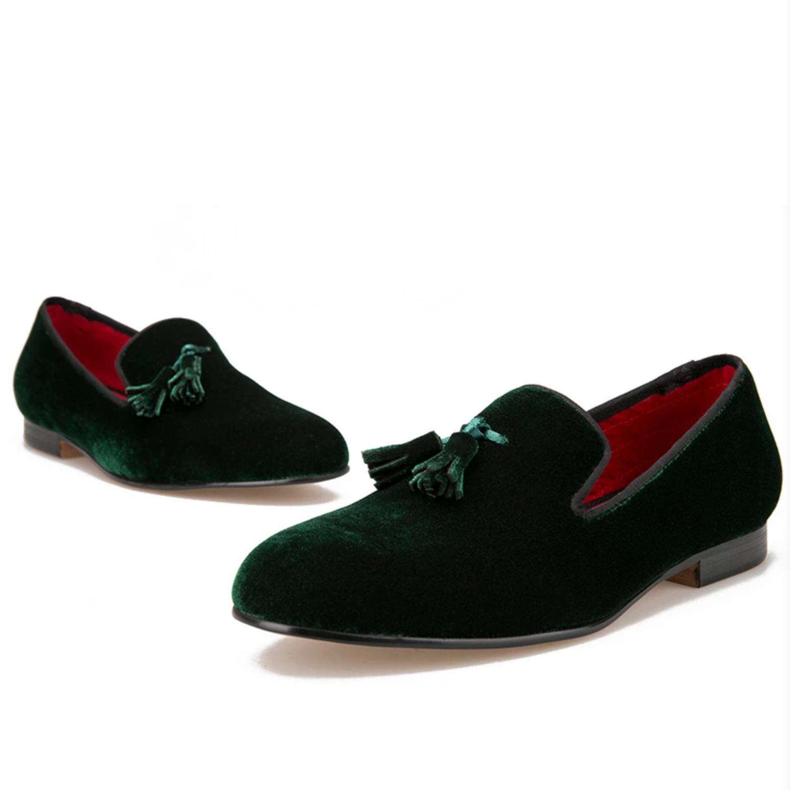 Forest-green velvet-look tasselled loafers with red quilted lining.