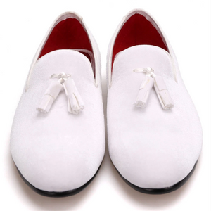 White tasselled loafers with a red quilted lining.