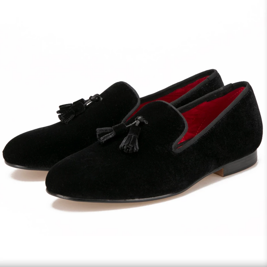 Comfortable black velvet-look loafers with quilted red lining.