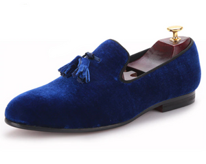 Royal blue velvet-look tasselled loafers with a plush, quilted red lining.